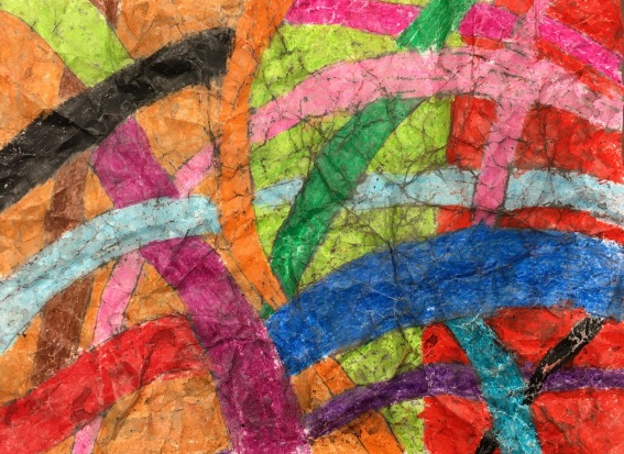 Students create wax resist artwork using crayons and india ink.